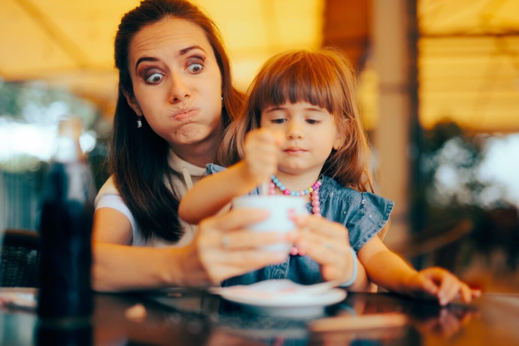 a mum and her young child at a table