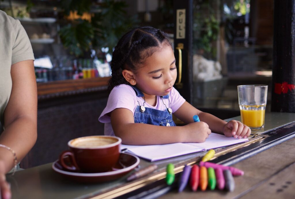 A child drawing with crayons