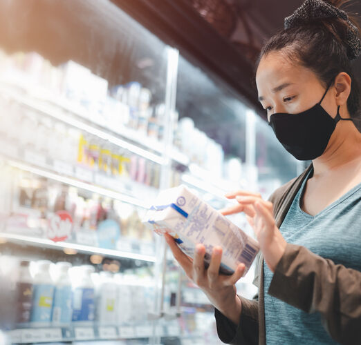 Asian,Woman,Wearing,Face,Mask,Shopping,In,The,Supermarket,During
