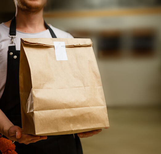 Diverse,Of,Paper,Containers,For,Takeaway,Food.,Delivery,Man,Is