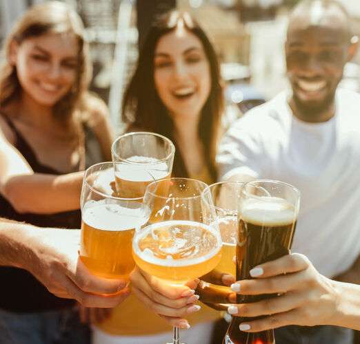 Young,Group,Of,Friends,Drinking,Beer,,Having,Fun,,Laughting,And