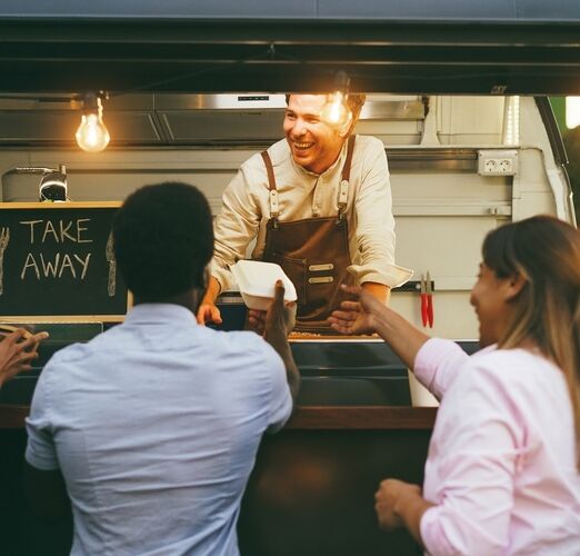 Multiracial,People,Ordering,Food,At,Counter,In,Food,Truck,Outdoor